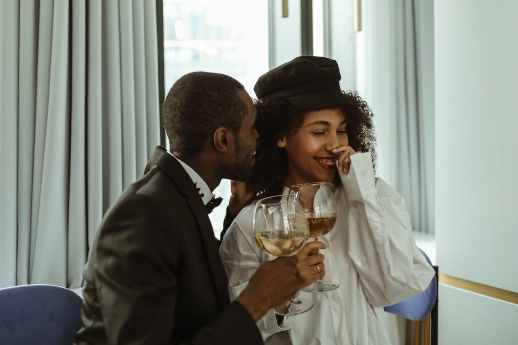 Man Whispering to a Woman